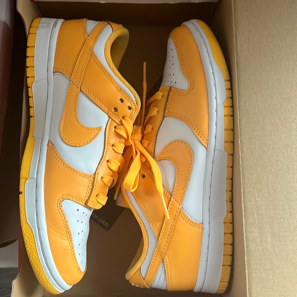 Very gently used, like new Laser orange low top Nike dunks. Size 7.